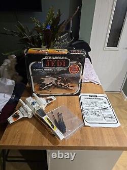 Chasseur X-Wing Star Wars vintage (endommagé lors de la bataille) dans sa boîte Kenner